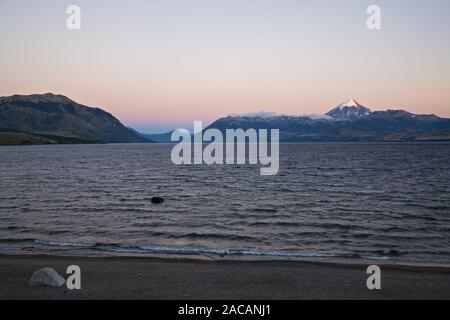 Lake Lago Huechulafquen with the volcano Lanin at sunrise, Argentina, Lake Lago Huechulafquen with Vulcan Lanin at sunrise Stock Photo