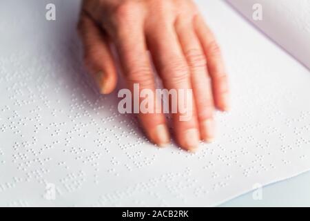 Braille and finger. Book in Braille Stock Photo