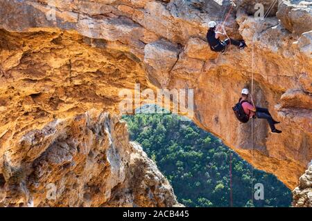 Adamit, Israel - November 30,2019: portrait of climbers descending from a rainbow cave in Western Galilee, Israel Stock Photo