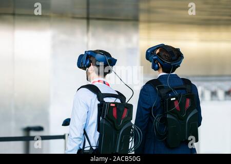A group of business people wear virtual reality glasses at a congress Stock Photo