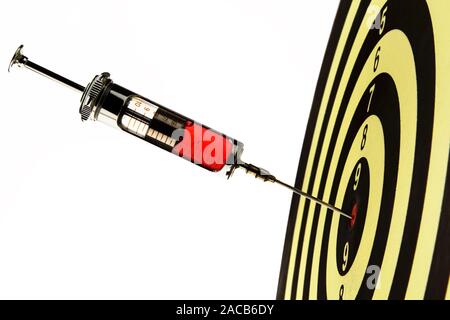 Syringe, injection into target Stock Photo