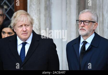 Prime Minister Boris Johnson (left) and Labour leader Jeremy Corbyn take part in a vigil in Guildhall Yard, London, to honour the victims off the London Bridge terror attack, as well as the members of the public and emergency services who risked their lives to help others after a terrorist wearing a fake suicide vest went on a knife rampage killing two people, was shot dead by police on Friday. Stock Photo