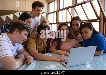 Teenagers in school classroom Stock Photo