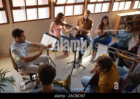 Teenage musicians rehearsing Stock Photo