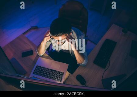 Hign angle above view photo of it skilled specialist guy sitting chair looking many monitors analyzing server debugging designing back-end security Stock Photo