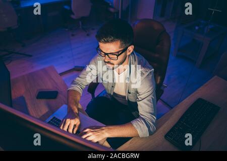Photo of it specialist guy working late hours sit chair look many monitors write secure code for website calculate algorithms content development Stock Photo