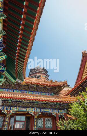 Beautiful traditional Chinese ornaments in various colors on the facade of the building. Stock Photo