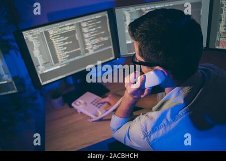 Profile side view portrait of his he nice attractive skilled guy sales department top manager answering calls providing assistance service consulting Stock Photo