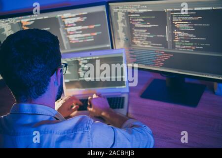 Rear behind view photo of it skilled specialist guy sitting comfy ...