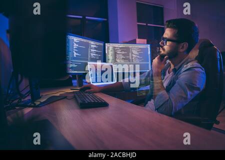 Profile side view portrait of nice attractive skilled smart focused guy thinking deciding creating solution debugging trouble problem shooting server Stock Photo
