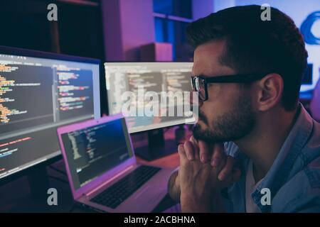 Close-up profile side view portrait of his he nice attractive skilled smart intelligent guy monitoring remotely client's project service solving Stock Photo
