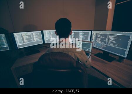 Top above high angle back rear view photo of manager of cyber security developing web site for his company searching for information about corporation Stock Photo