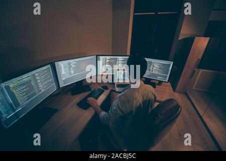 Top above high angle view photo of entrepreneur having studied to be programmer knowing how C works engaging laptop in work surrounded with screens Stock Photo