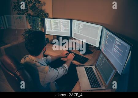 Top above high angle view photo of system administrator writing code using C language to improve corporation software and make data base more Stock Photo