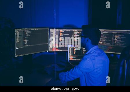 Profile side view of his he nice senior middle top specialist brunet guy providing service outsource tech solving problem debug report quality testing Stock Photo