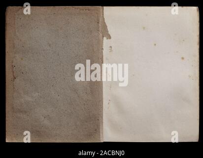 Antique book unfolded on the Endpaper, showing aged textured paper inside, isolated on black background. Stock Photo