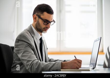 Young businessman is working in office. Stock Photo