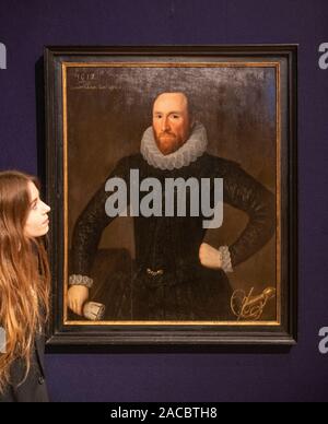 Bonhams, London, UK. 2nd December 2019. Old Masters Painting sale preview at Bonhams. Image: Attributed to Robert Peake the Elder (circa 1551-1619 London). Portrait of a gentleman, traditionally identified as Sir James Porter, three-quarter-length, in black costume, holding his gloves. Estimate: £15,000-20,000. Credit: Malcolm Park/Alamy Live News. Stock Photo