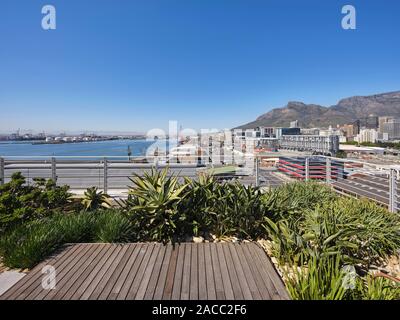 Communal rooftop terrace with view towards harbour and Table Bay. Silo District Cape Town, Cape Town, South Africa. Architect: VDMMA, 2019. Stock Photo