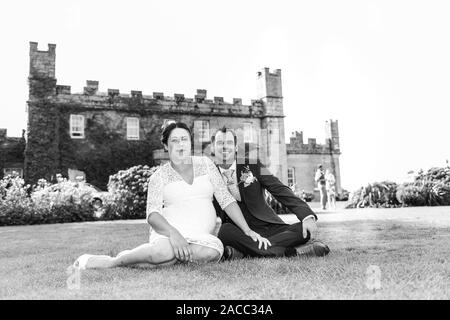 A mixed race couple married at Tregenna Castle Resort and Carbis Bay Beach, Seaside village, Saint Ives, (Caucasian, Black), pregnant bride, pregnancy Stock Photo