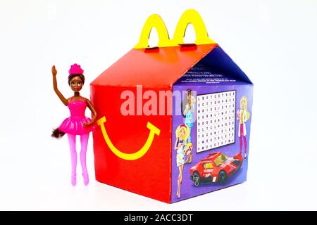 McDonald's Happy Meal cardboard box with Mattel Barbie doll. McDonald's is a fast food restaurant chain. Stock Photo