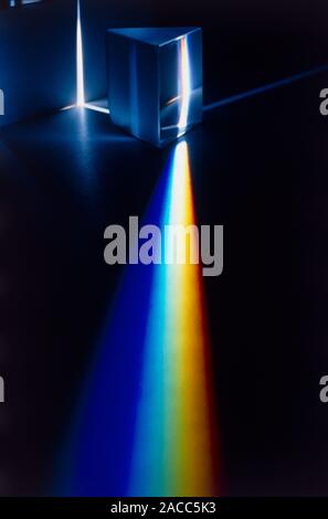 White light passing through triangular prism. Stock Photo