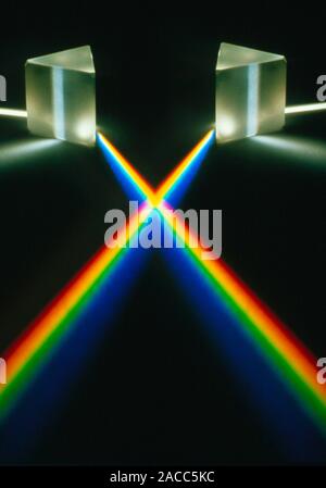 Multiple exposure of white light through a triangular prism. Stock Photo