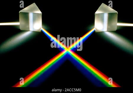 Multiple exposure of white light passing through a triangular prism which splits the light into spectral colours. Stock Photo