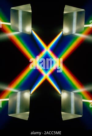 Multiple exposure of white light through a triangular prism. Stock Photo