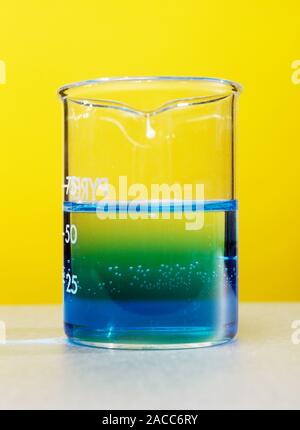 Blue ink diffusing in water. Diffusion is the random movement of molecules that eventually leads to an evenly distributed mixture. When the blue ink w Stock Photo