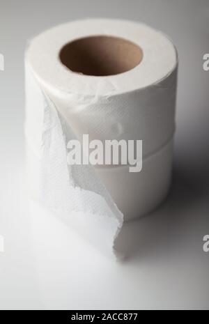 A single roll of white toilet paper. Stock Photo