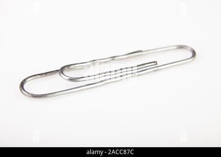 A single Metal Paper Clip Isolated on White Background Stock Photo