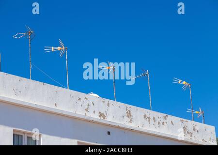 TV aerials against a vivid blue sky Las Caletillas, Santa Cruz, Tenerife, Spain Stock Photo