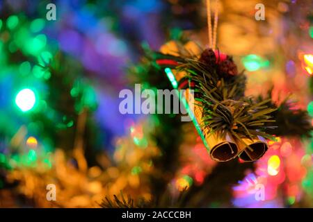 Music instrument ornament on a beautifully decorated Christmas tree in Bordeaux, France Stock Photo