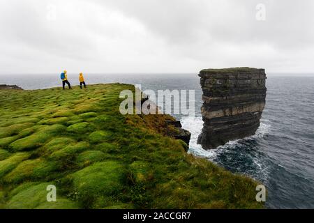 Downpatrick Head, Ballycastle, County Mayo, Donegal, Connacht region, Ireland, Europe. Mother and s watching the sea stack from the top of the cliff. Stock Photo