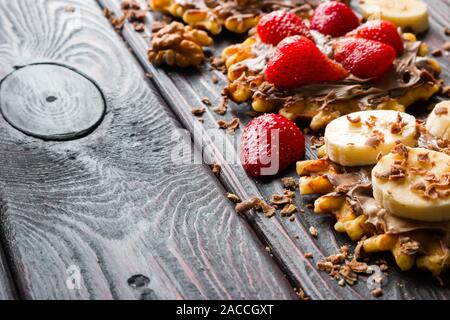 strawberries and bananas on wafers with chocolate paste Stock Photo