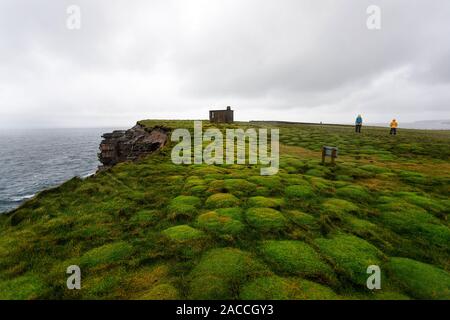 Downpatrick Head, Ballycastle, County Mayo, Donegal, Connacht region, Ireland, Europe. Mother and s watching the sea stack from the top of the cliff. Stock Photo