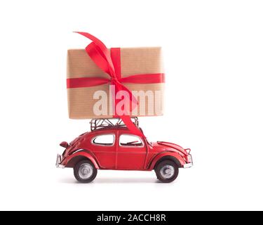 Red retro car Volkswagen Beetle with Christmas presents on white background Stock Photo