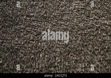 old weathered thatched roof, thatch or thatching background texture Stock Photo