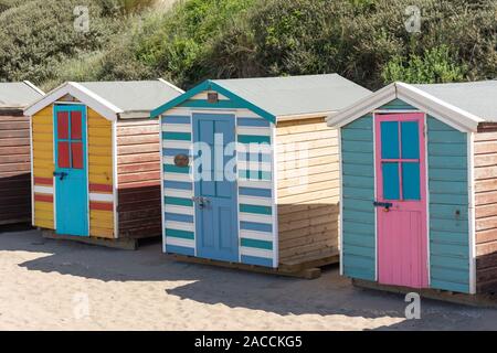 Colourful beach huts, Saunton Sands Beach, Saunton, Devon, England, United Kingdom Stock Photo