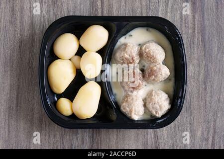 meatballs and potatoes microwavable instant ready meal or tv dinner, german dish known as Konigsberger Klopse Stock Photo