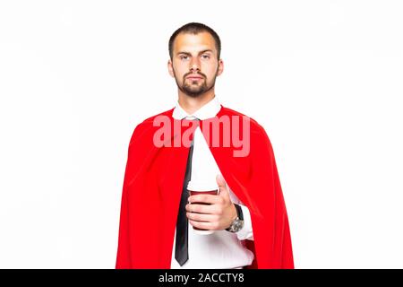 Businessman dressed like superhero drinking coffee Stock Photo