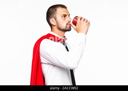 Businessman dressed like superhero drinking coffee Stock Photo
