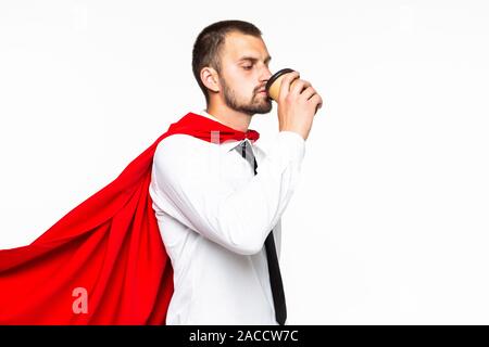 Businessman dressed like superhero drinking coffee Stock Photo