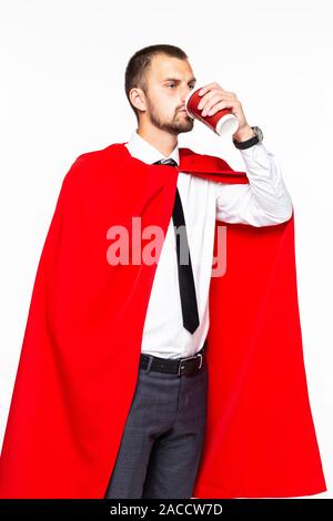 Businessman dressed like superhero drinking coffee Stock Photo