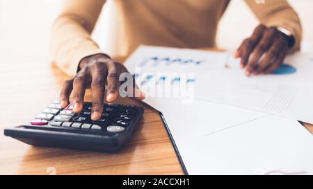 African american accountant calculating budget of the company Stock Photo