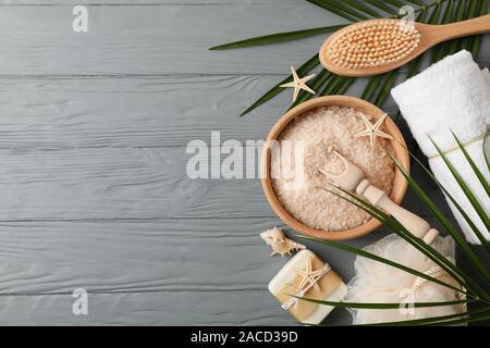 Composition with spa accessories on grey wooden background, space for text Stock Photo