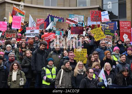 Glasgow, UK. 2nd Dec, 2019. UK. Members of the University and College Union (UCU) at 60 institutions are taking strike action from 25 November - 4 December. They are striking for better pay and working conditions. These workers gathered at the city's Buchanan Street steps with banners and flags Credit: Douglas Carr/Alamy Live News Stock Photo
