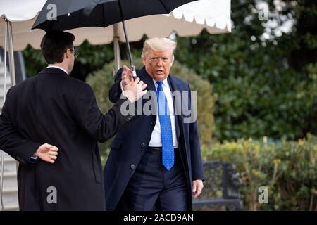 London, UK. 2nd Dec, 2019. United States President Donald J. Trump speaks to members of the media on the South Lawn of the White House in Washington, DC, U.S., as he departs for the NATO summit in London, United Kingdom, on Monday, December 2, 2019. Credit: Stefani Reynolds/CNP | usage worldwide Credit: dpa/Alamy Live News Stock Photo