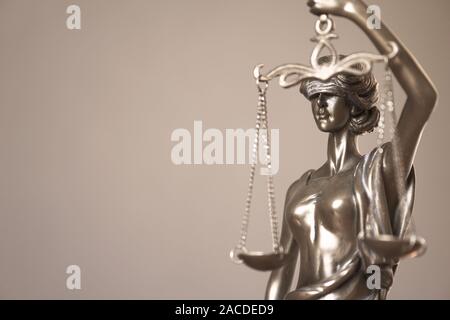 lady justice or justitia - detail of blind or blindfolded bronze statue holding balance scales - law jurisprudence and impartiality symbol - background with copy space Stock Photo